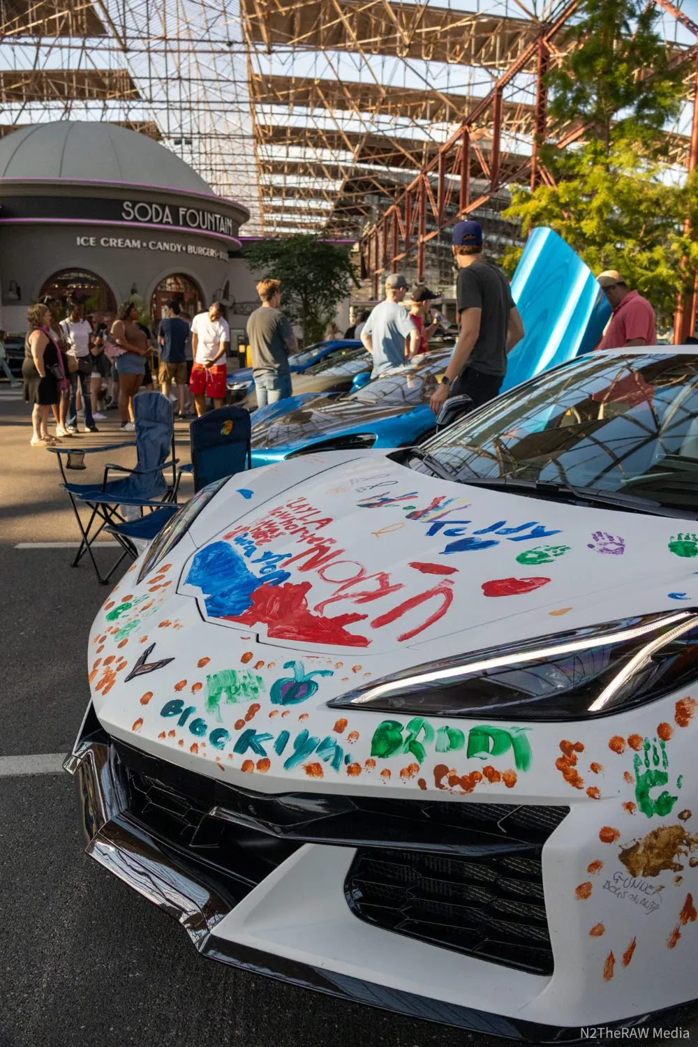 Handprint-painted Corvette at a community car show